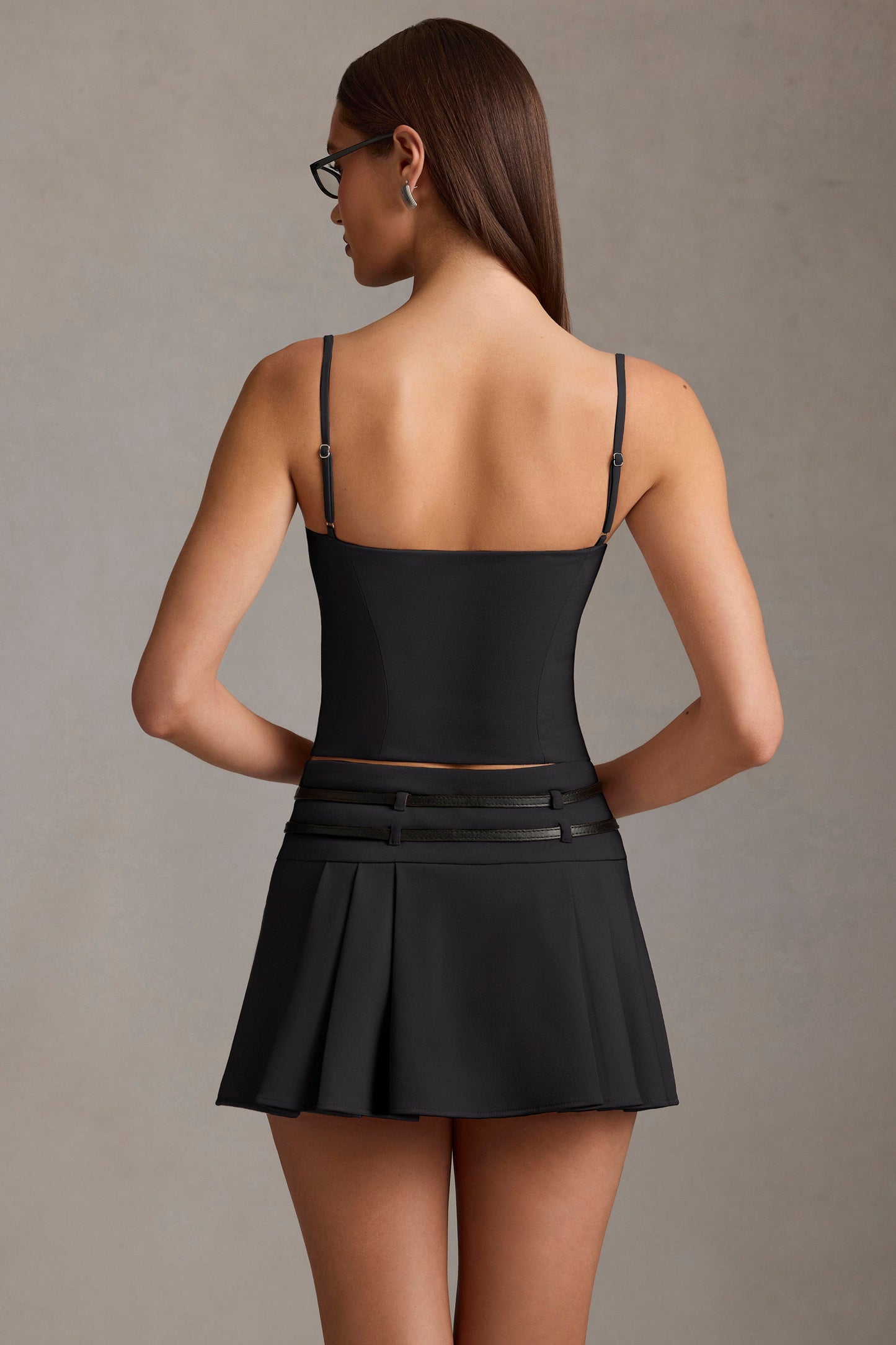 Belted Low-Rise Pleated Mini Skirt in Black